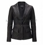 front view of Black Padded Leather Blazer featuring wide peak lapels, one button, flap pockets, and horizontal ribbed stitching on the sides and sleeves with Maker Of Jacket brand label.