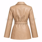 Back view of a women's beige belted leather trench coat showcasing tailored vertical seams and a fitted waist belt.