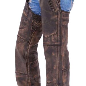 Someone stands against a white background wearing 4 Pocket Vintage Brown Leather Chaps Removable Lining over ripped blue denim shorts and tan sneakers.