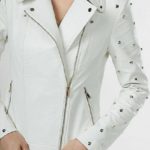 Front view of women’s white leather jacket with silver studded detailing