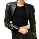 Front view of vintage leather biker jacket with black flame design