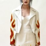 Front view of vintage leather biker jacket with white flame design