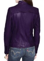 Back of quilted detailing and shiny zippers on purple leather jacket