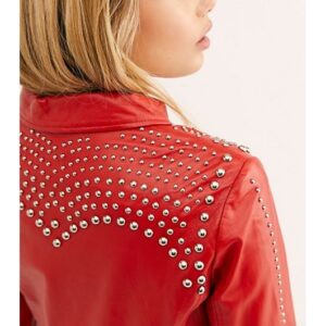 Detail shot of silver studs and grain texture on black leather jacket