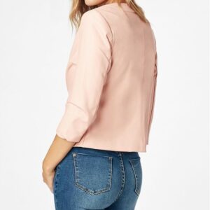 Back of women's soft pink jacket highlighting cropped sleeves