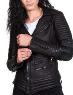 Front view of black women's leather biker jacket with asymmetrical zipper design