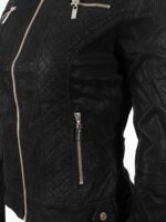 Close-up of soft suede texture and zipper details on women's moto jacket