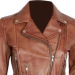 Close-up of vintage distressed leather texture on brown biker jacket