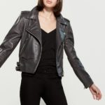 Front view of women's dark grey leather moto jacket with sleek zipper design