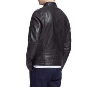 Model wearing Gatz leather biker jacket with dark jeans and a graphic tee
