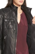 Flat lay of Brandi black leather biker jacket with quilted lining and hardware details