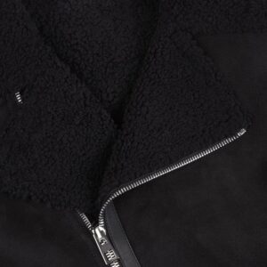 Close-up of luxurious black fur lining inside Cartier leather jacket