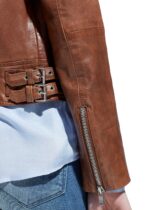 Close-up of brown leather texture on Stella biker jacket with matte finish