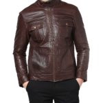 Model wearing Kanye-inspired biker jacket styled with sneakers and sunglasses