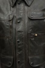 Close-up of rich black leather grain on Kensington jacket with silver detailing