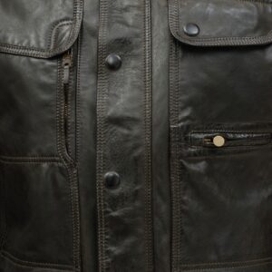 Close-up of rich black leather grain on Kensington jacket with silver detailing