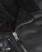 Detailed view of leather grain and stitching on Roger black jacket