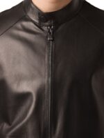 Model in black leather jacket with suave tailored fit and urban sophistication
