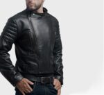 Side profile of black leather motorcycle jacket with minimal stitching and bold fit