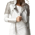 White leather biker jacket featuring long silver spikes and bold studded detailing on shoulders