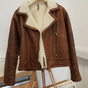 Men’s brown leather flying jacket with sheepskin collar and classic biker design.