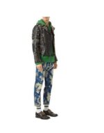 Fashion shoot of edgy biker jacket with studded accents, black leather, and bold lines