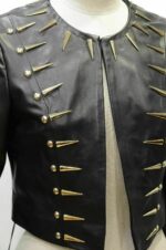 Woman modeling black silver spiked leather jacket with studded biker punk rock design