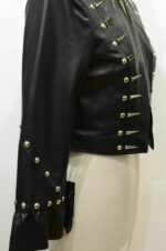 Front view of long women’s punk rock leather jacket with silver studs and sharp spikes