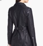 Fitted women's leather biker jacket with waist belt and zippered accents, perfect for street-style fashion.