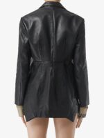 Stylish women's biker jacket in black leather with buckle belt and zippered details.