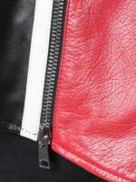 Black motorcycle coat with dramatic fringe details and zippered front for a stylish, rebellious vibe.