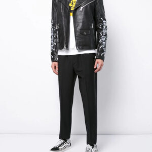 Black leather jacket with silver zippers and bold skull and crossbones sleeve accents, exuding punk rock attitude.
