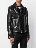 Black leather biker jacket with multiple silver zippers and metal studs, featuring a belted waist for a bold, edgy silhouette.