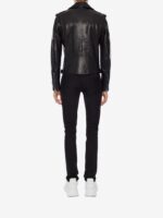 Sleek black leather biker jacket with silver zippers, buttons, and asymmetrical front, lined with skull pattern for a rebellious edge.