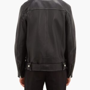 Rear view of a person wearing a sleek black leather jacket with a wide collar and adjustable waist belt, paired with black pants on a white background.