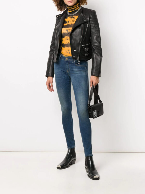 women’s black leather motorcycle jacket with snap buttons, buckle details, and quilted shoulder accents for a bold edge.