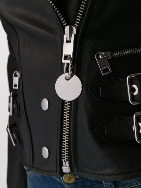 Edgy black leather jacket with asymmetrical zip front, quilted shoulders, and silver hardware, combining fashion and function.