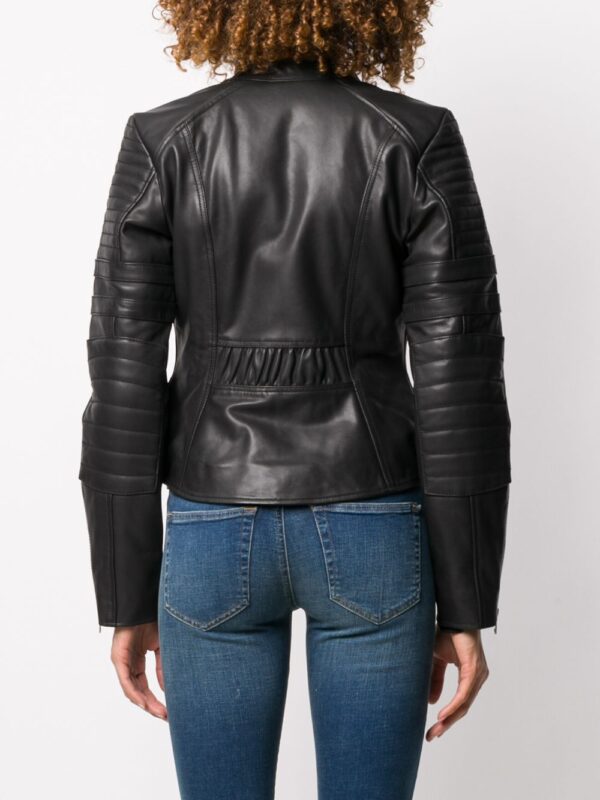 Black leather motorcycle jacket with silver zippers, snap buttons, buckles, and quilted shoulders for a rugged, stylish look.