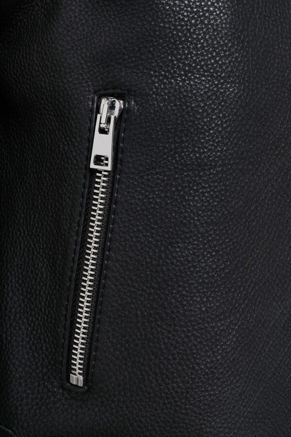 Close-up of embellishments on black biker leather jacket premium texture Close-up of embellishments on black biker leather jacket premium texture