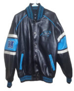The Vintage NFL Carolina Panthers Football Team Leather Jacket is black with blue and white stripes, featuring the Panthers logo on the chest and a vintage patch with stars on the left sleeve—a perfect pick for classic NFL fans.