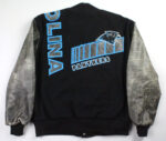 The Vintage NFL Carolina Panthers Varsity Jacket features a black body, gray sleeves, the team logo, PANTHERS text, and bold blue outlined OLINA lettering on the back—a must-have for any Carolina Panthers fan.