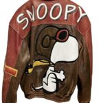 A Snoopy Cartoon Leather Jacket featuring a large image of Snoopy wearing goggles and scarf, with “SNOOPY” written in large white letters on the back.