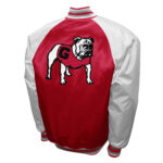 Back view of Georgia Bulldogs NCAA Red and silver satin varsity jacket featuring large Bulldogs logo eye graphic, and striped ribbed collar and waistband.