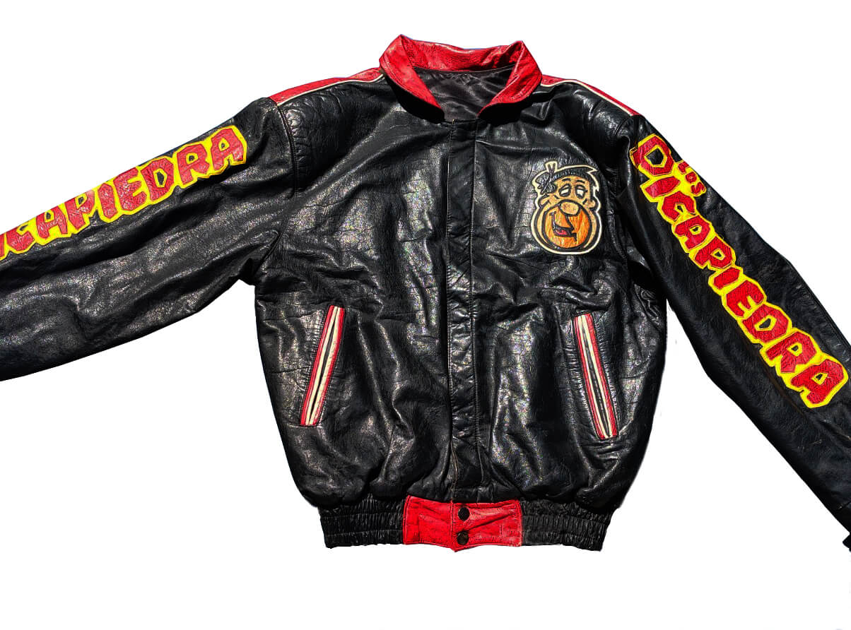 Vtg-The-Flintstones-Cartoon-Leather-Jacket-1 front view of the flintstones leather jacket chest applique logo with snap closure.