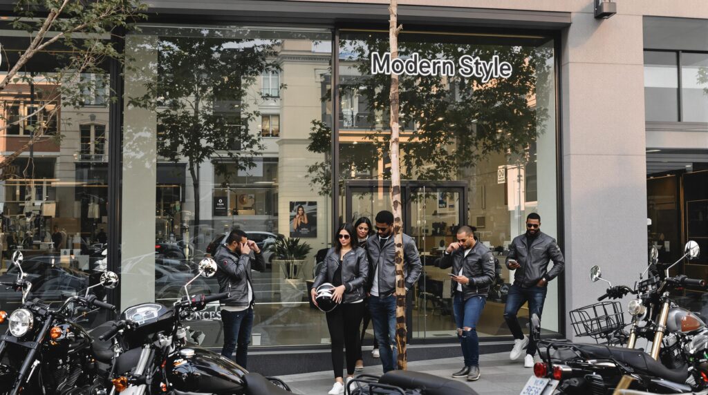 Diverse group in modern biker jackets on urban street at sunset