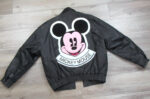 Disney Mickey Mouse leather jacket with large pink and black Mickey Mouse face patch and “Mickey Mouse” text on back