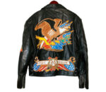 "Vintage black leather biker jacket with bold eagle appliqué on the back, epaulets, and side lace detailing."