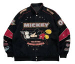 Front view of Vintage Mickey Mouse Racing Across America black and red cotton bomber jacket with iconic Mickey patch and snap-button closure.