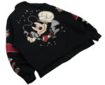 Left sleeve close-up of black and red Mickey bomber jacket with bold “05” racing patch.