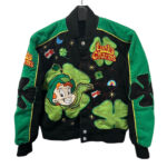 Vintage NASCAR Lucky Charms kids bomber jacket with embroidered Lucky the Leprechaun, four-leaf clovers, and cereal marshmallows on green and black fabric.